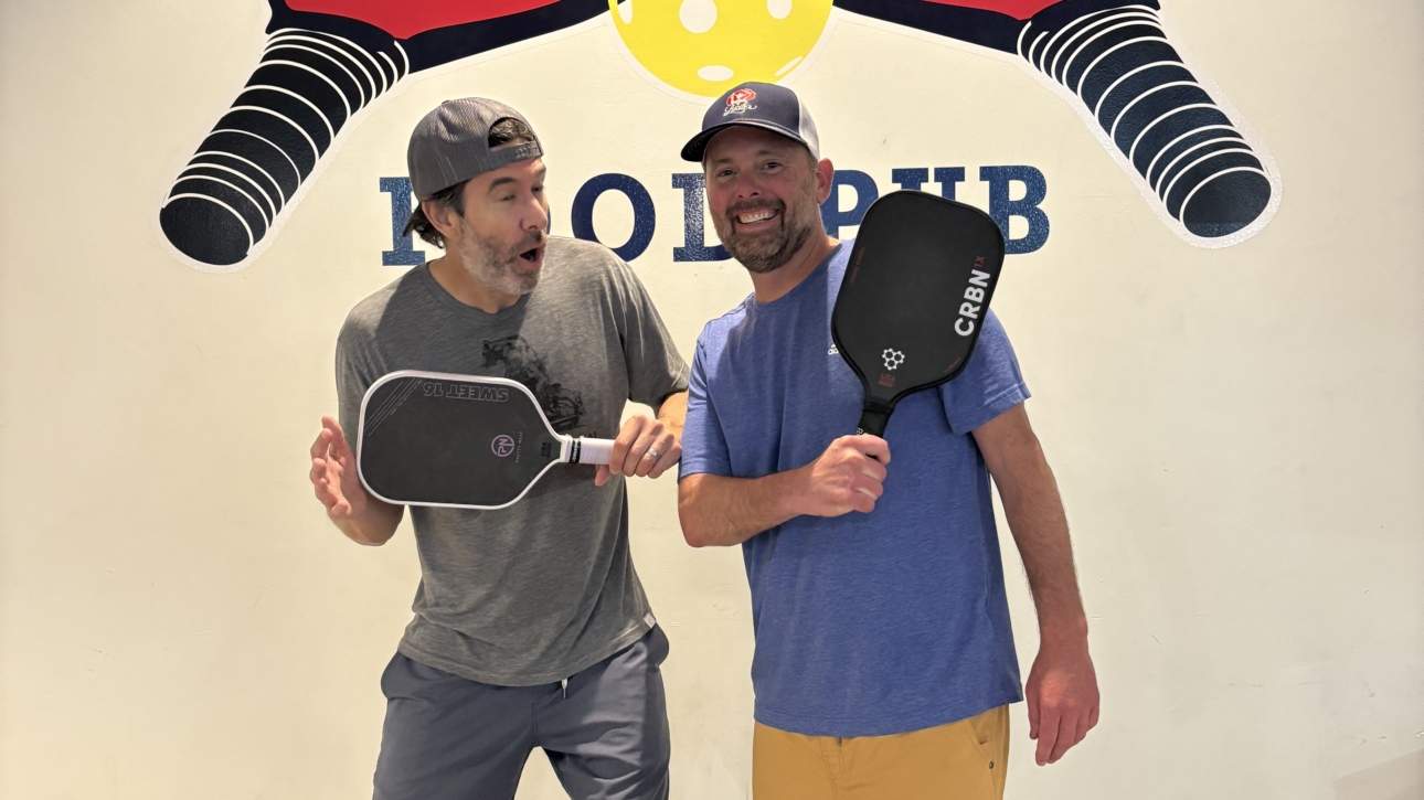 Excited pickleball duo with hats