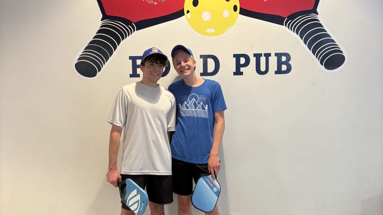 Happy pickleball champs posing together