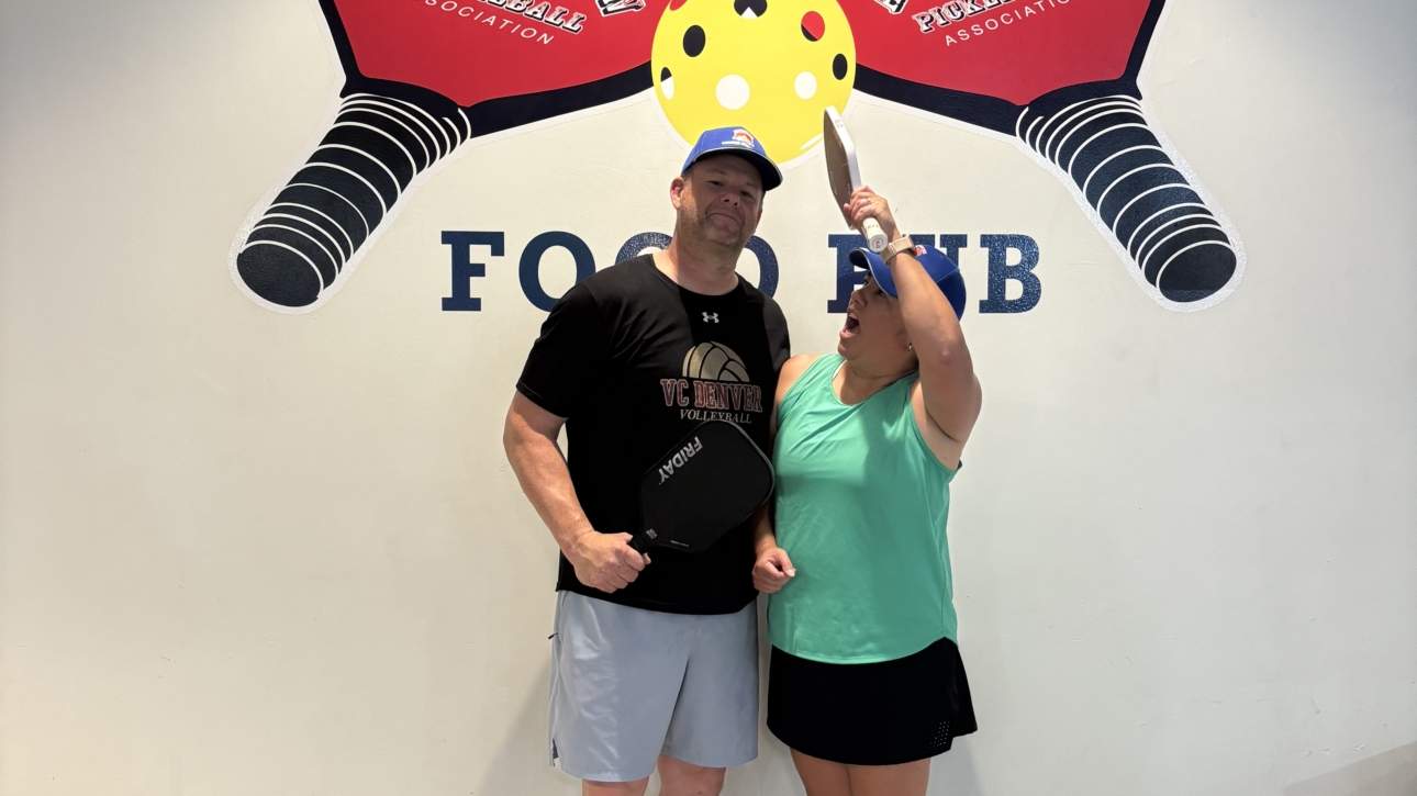Playful pickleball couple moment