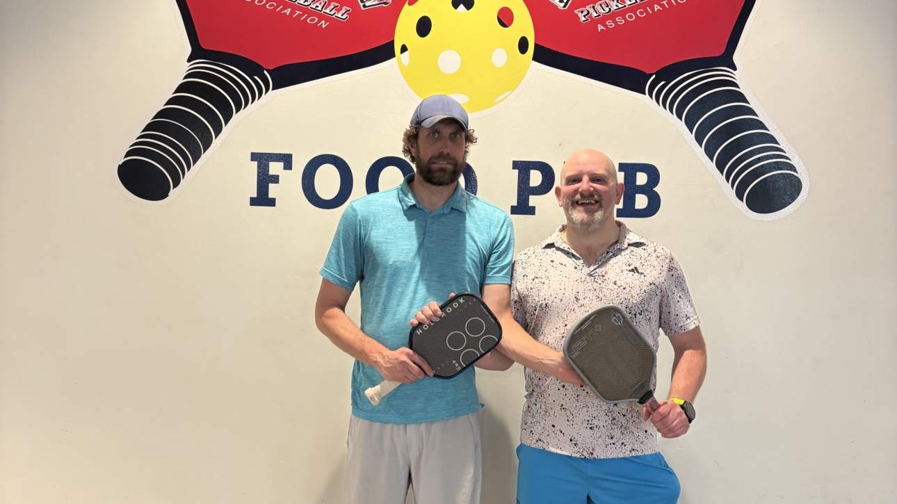 Happy pickleball duo smiling