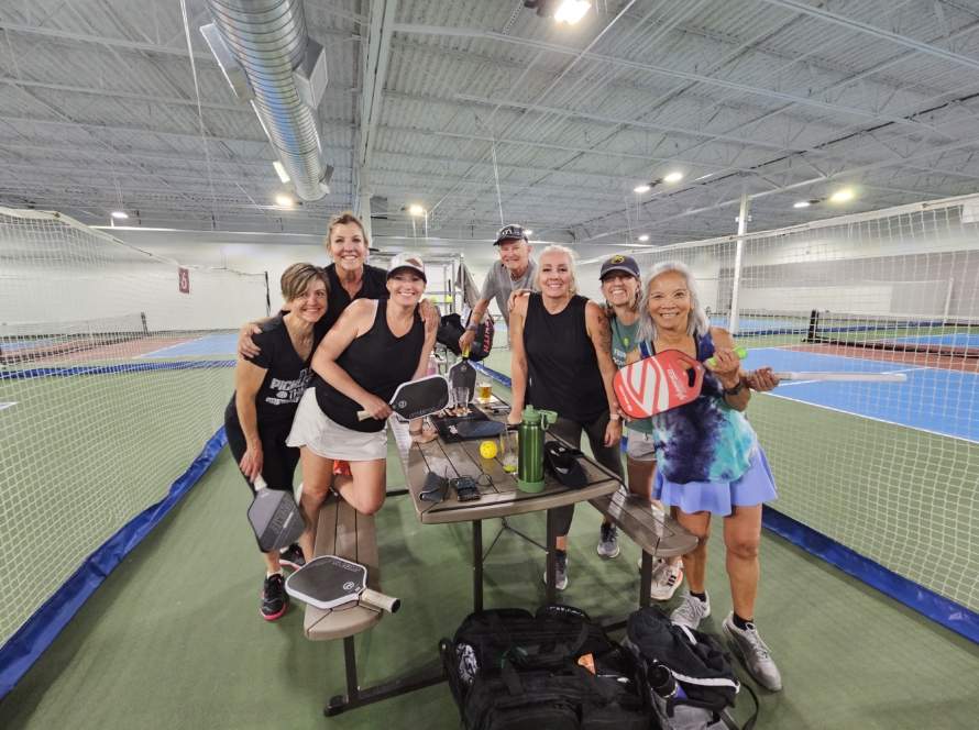a group of p[eople smiling at the Pickleball Food Pub in Colorado