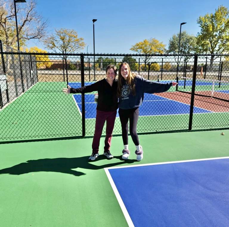 two people outside at the Pickleball Food Pub in Westminster, CO